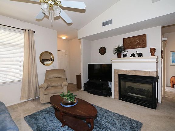Great room, gas fireplace is two-sided, facing great room and dining room.