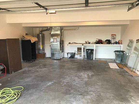 Double car garage that is a little bigger than a standard garage.