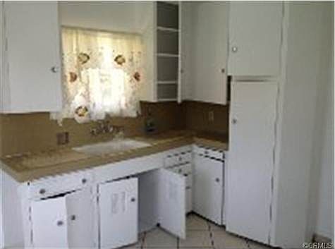 Kitchen of upstairs 2 br 1 bth unit was rented for $1200 mo