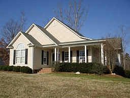 Beautiful front entrace with a wrap-around porch for relaxing
