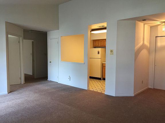 Living Room - View of (left to right) bedroom 2, master bedroom, kitchen, entry