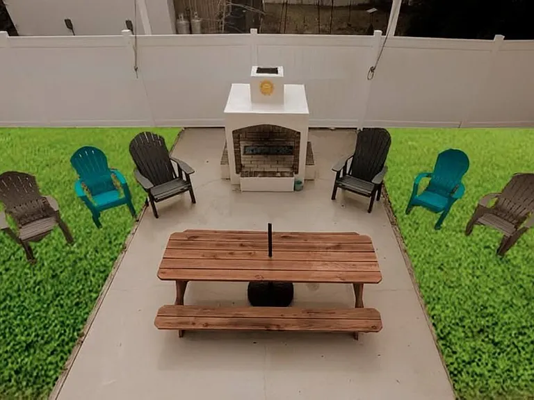 Large picnic table in front of firepit
