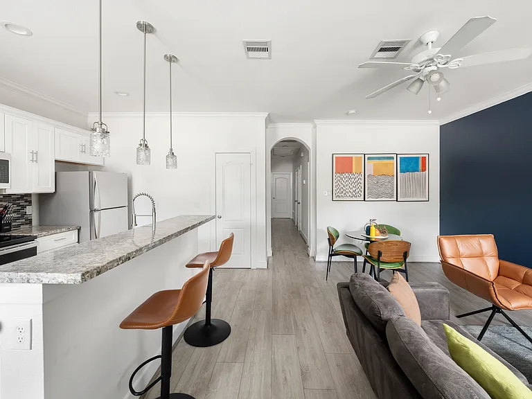 Bright, open-concept living and dining area with stylish modern furnishings.
