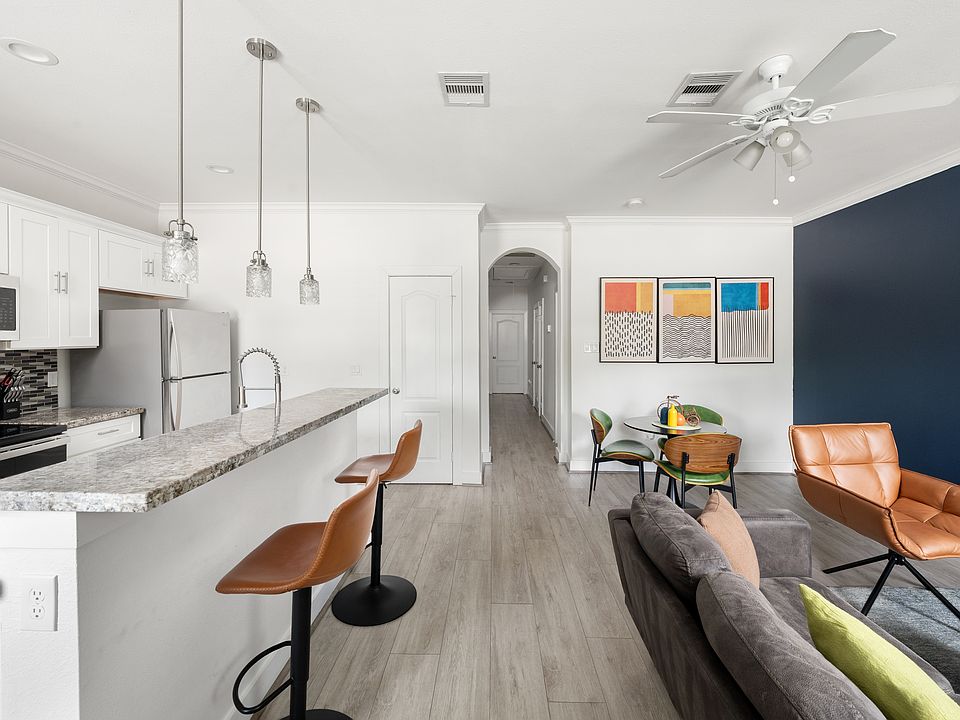 Bright, open-concept living and dining area with stylish modern furnishings.