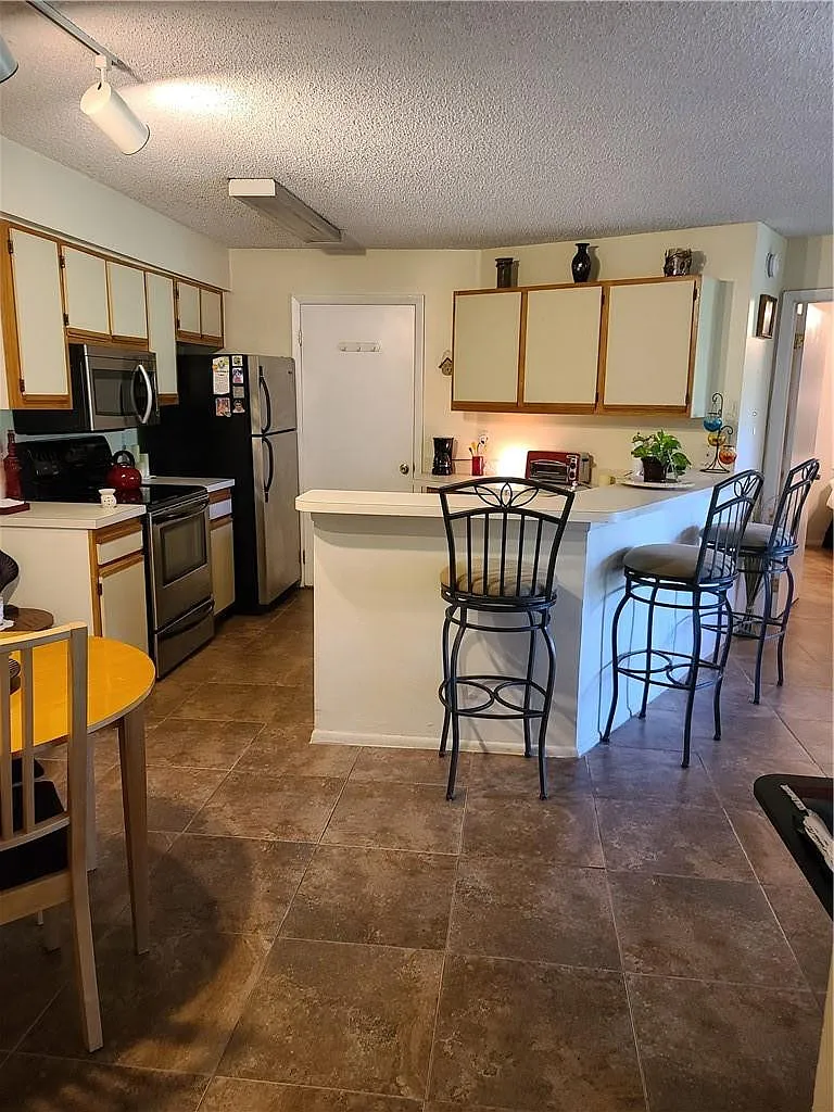 Building Photo - 9999 Summerbreeze Dr #417