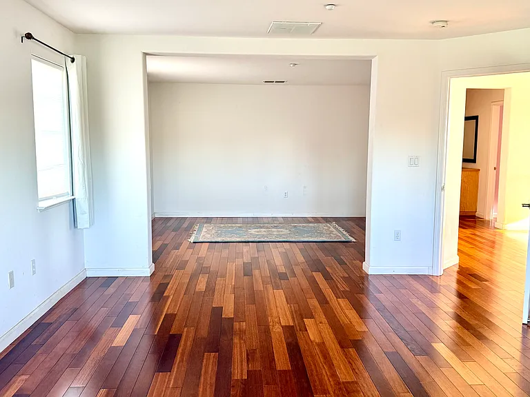 Primary bedroom with a versatile open sitting or office area