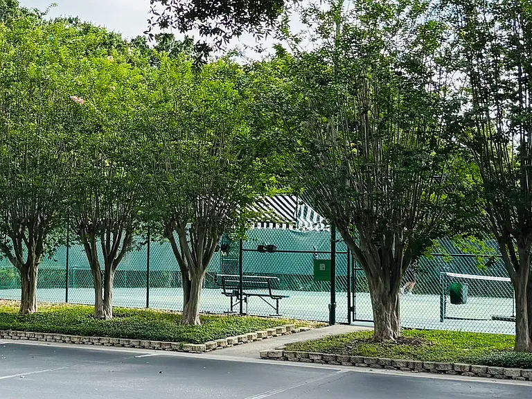Two tennis courts in gated club house
