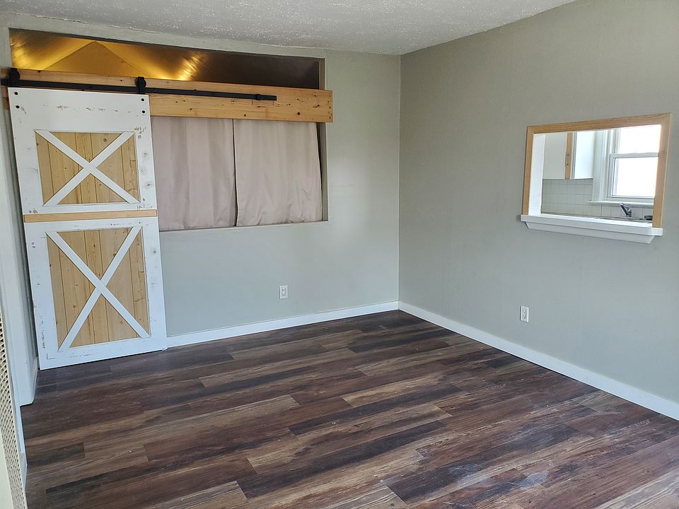 Living area looking into kitchen pass through.
