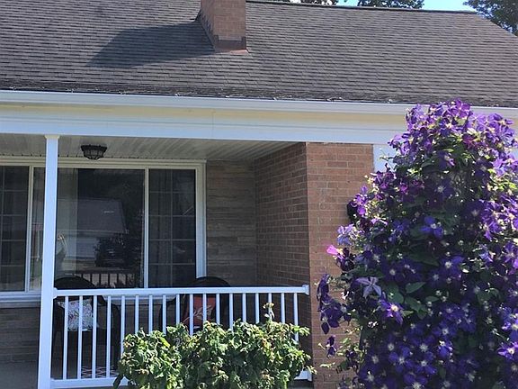 Brand new railing added, just in time for sitting on the front porch and enjoying the beautiful clematis in bloom.