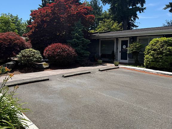 Front yard, office has 9 parking stalls with on street parking