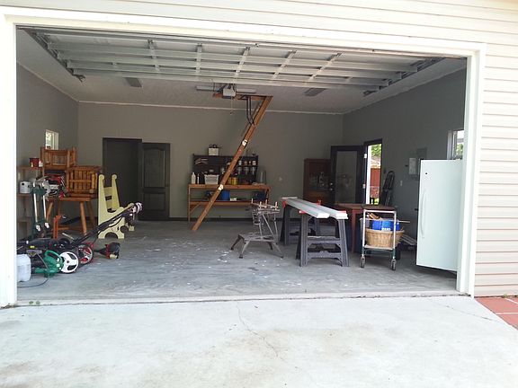 Inside garage. with high ceilings and automatic garage door 