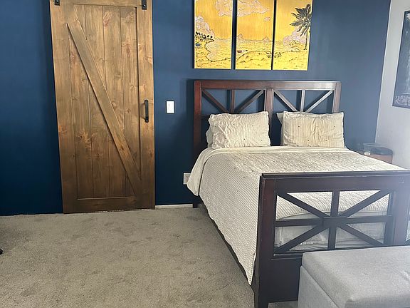 Slider barn door to primary bathroom