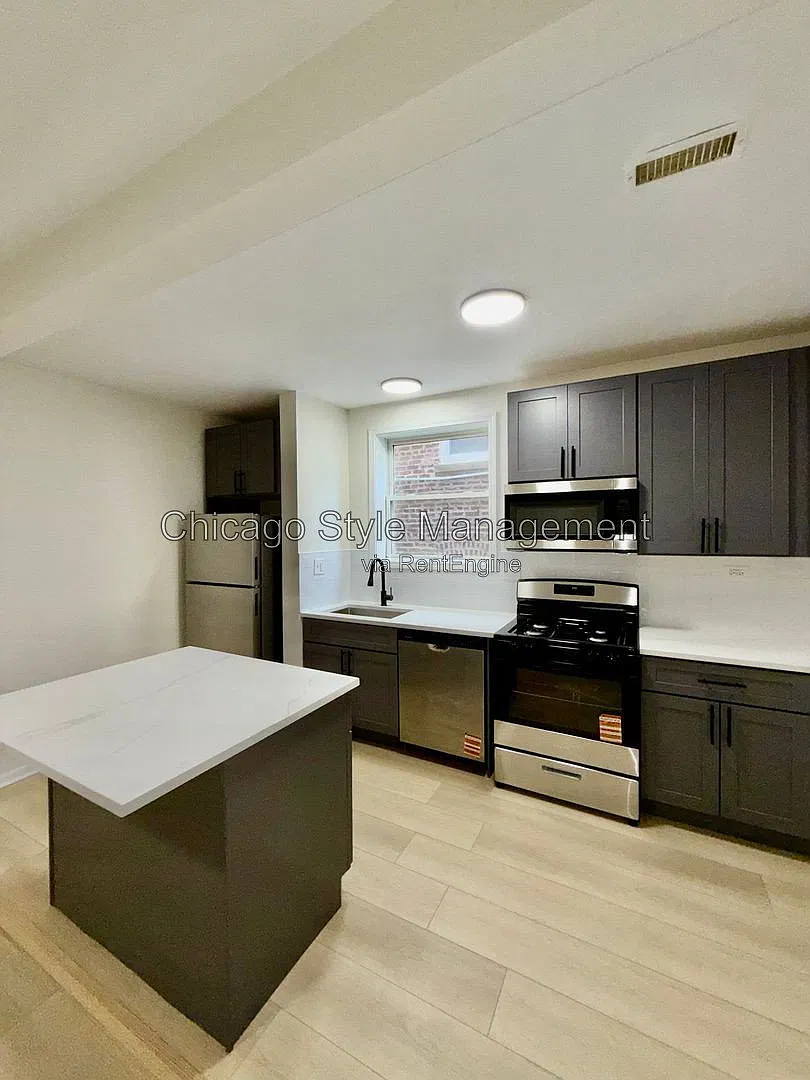 7833 S Colfax Ave — Photo 2