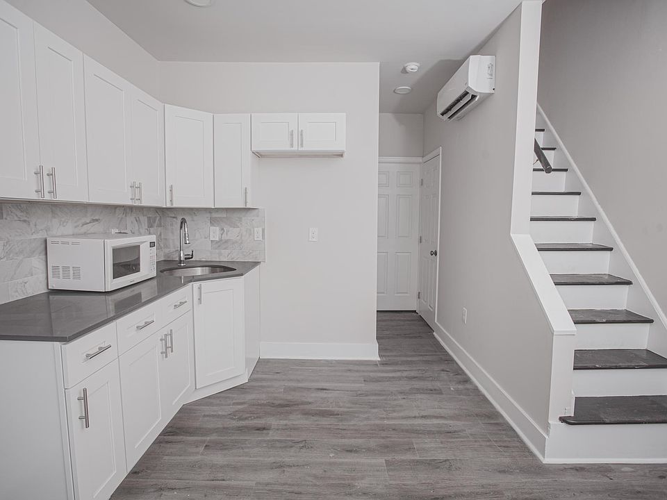 Kitchen includes a stove and fridge