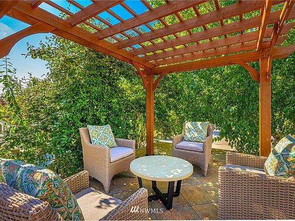 Pergola-covered patio in front yard
