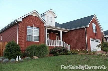 Front of House View #1
						:
						Notice the professionally landscaped yard designed with low maintenance in mind