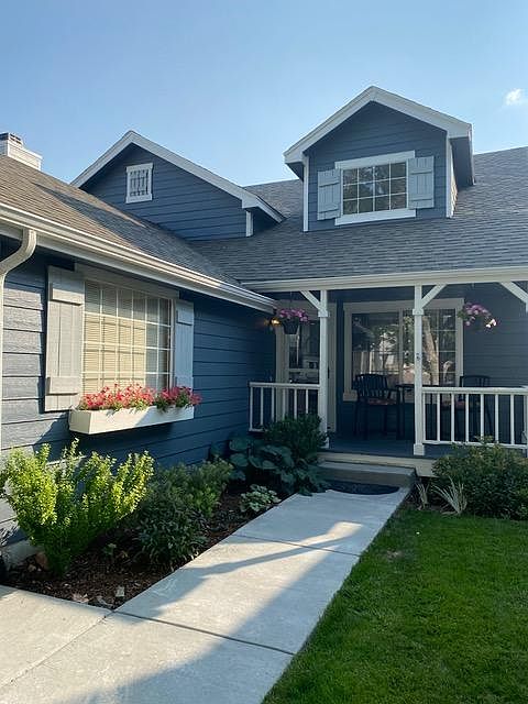 Front of house with porch and flower boxes