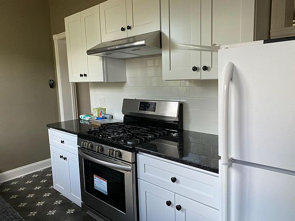 New range and hood, new cabinets and granite countertops waiting for a couple of good cooks. Just delivered _ a new stainless fridge with ice maker. (not shown).