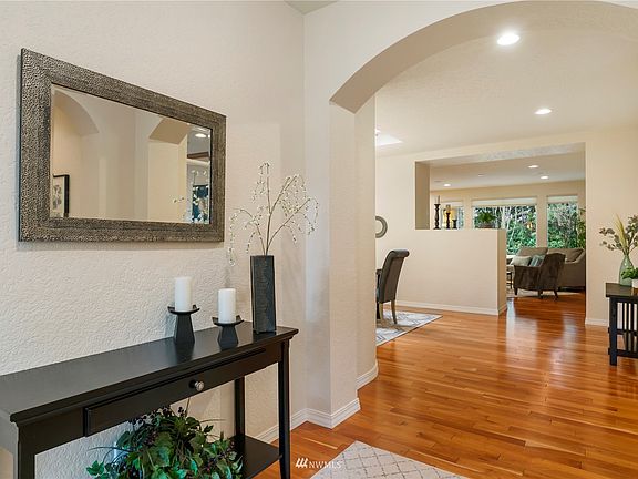 Layout draws you into the dining room (left) and great room beyond.