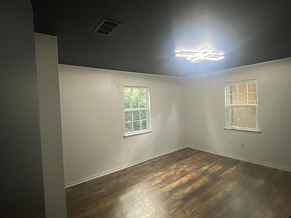 Master bedroom comes with new paint, new floors, an accent wall and a modern light!