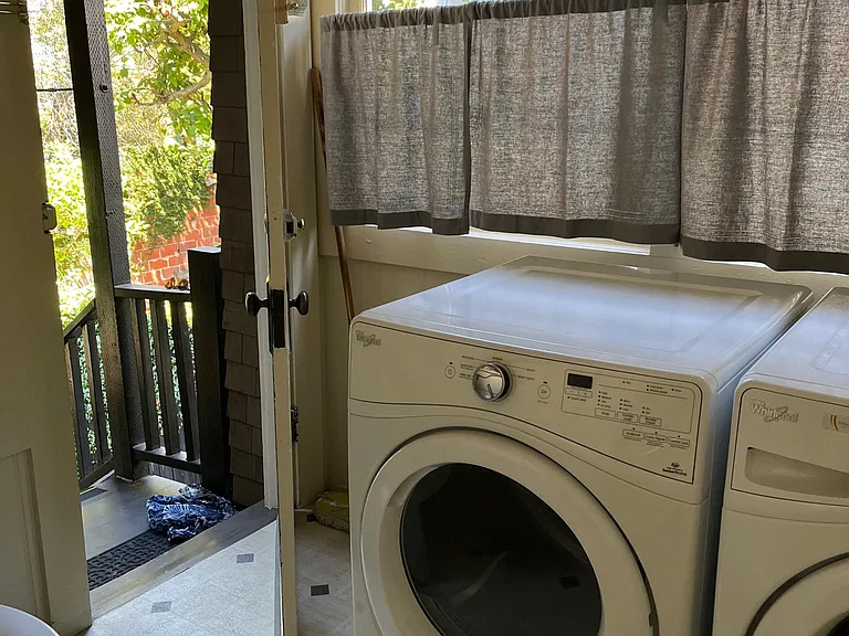 Laundry room and toilet. This back entrance leads to outside yard.
