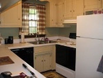 kitchen, all appliances convey and ceramic floors with breakfast bar.