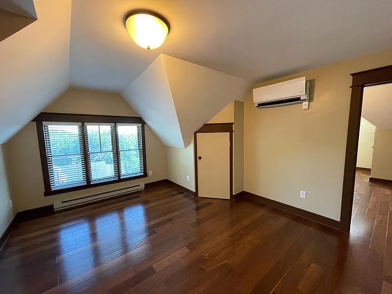 Living room from just inside the front door.The bedroom is to the right. The kitchen is located to the left