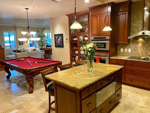 Pool table converts to table that seats 8.