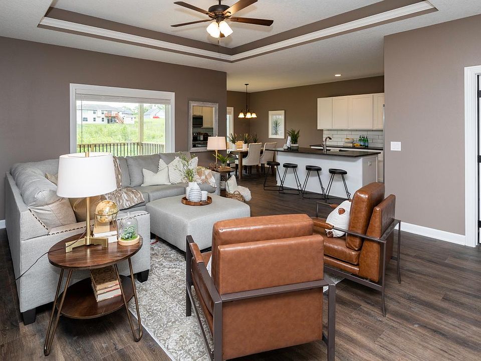 Spacious open layout in living room and kitchen. Granite counters, island sink and easy access to the covered deck.