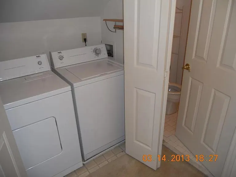 master bedroom with full bath and laundry