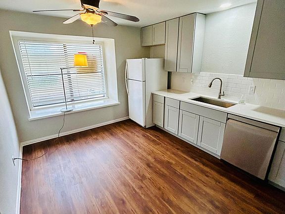 Natural lighting in kitchen. New oversized kitchen shaker style cabinets, new appliances, new flooring, new paint, new LED lights