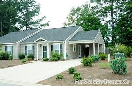 Carport with Storage Room