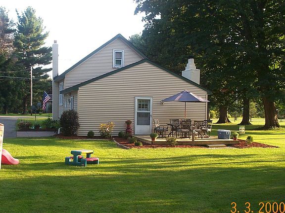 Large backyard with above-ground pool.