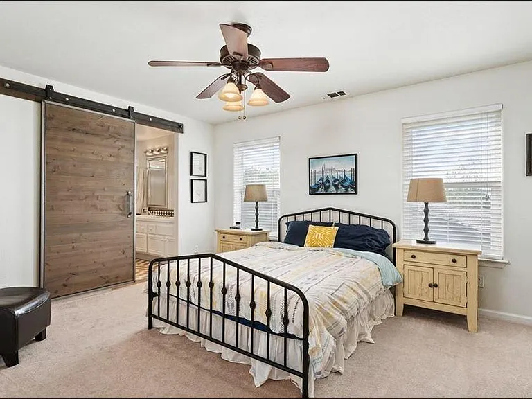 Master bedroom upstairs with attached bathroom.