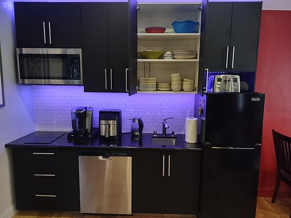 Kitchen with everything you need. Microwave, dishwasher, air fryer, toaster, kettle, dishes, and more.