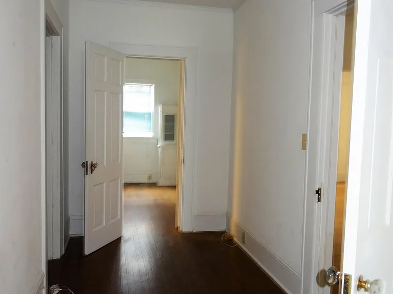 Hallway showing the door leading to dining area.