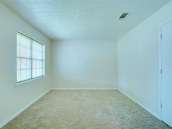 LIVING AREA WITH NATURAL LIGHTING & NEUTRAL COLORS...