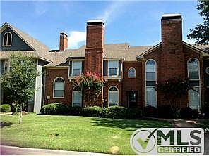 Lovely landscaping and stylish brick greet visitors to 108 Cobbl