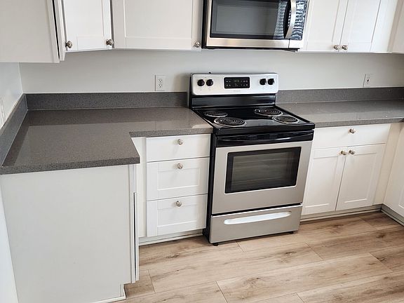 Electric range/oven. Large microwave.