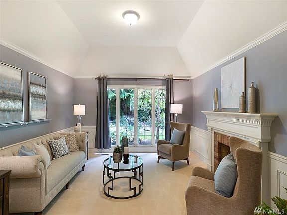 Step into the cozy formal Living Room, light a fire and dive into your favorite book. Crack open the window to listen to the soothing babbling of the outdoor water feature. The vaulted ceiling with crown moulding adds coziness to this room.