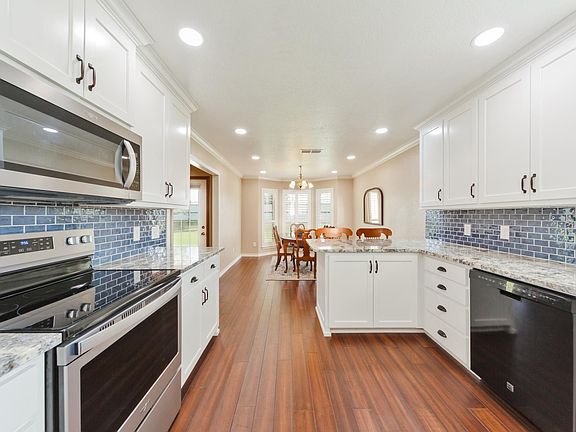 Kitchen with Oven Range, Microwave, Refrigerator/Freezer & Dishwasher