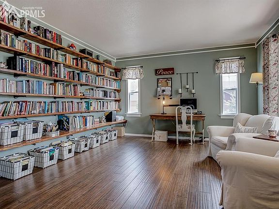 Library/office area with bamboo flooring, custom wood shelving and custom crown 