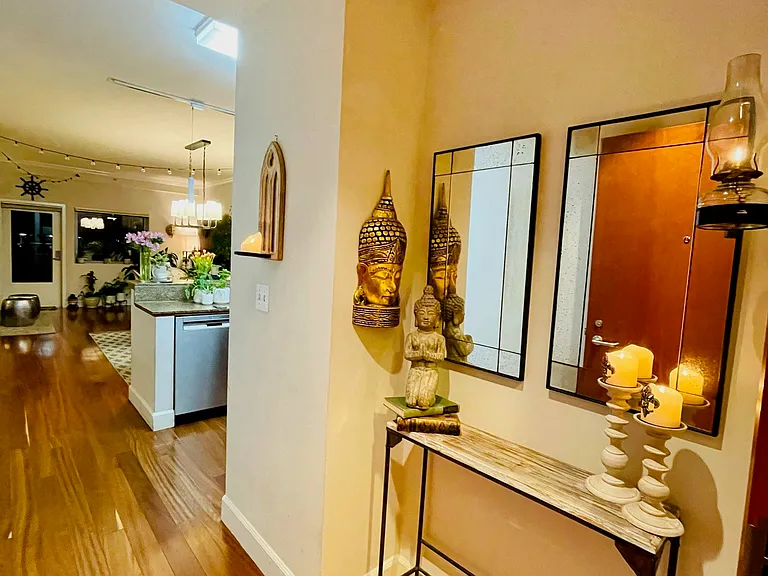 Entry hallway with hardwood flooring and access to the main living areas.