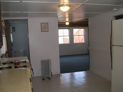 Kitchen to Liv Room.  Bath on L