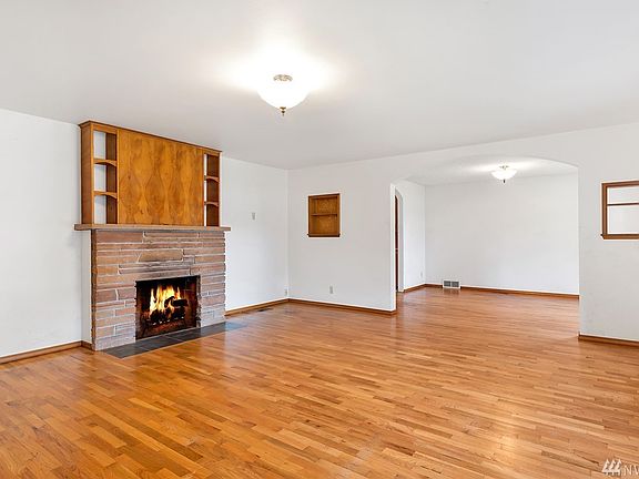  Living Room - home offers site finished hardwood floors (solid oak material and it is in great shape). 