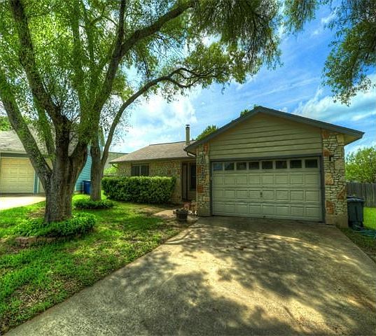 Huge trees welcome you- 2 car garage with garage opener- lots of room for parking