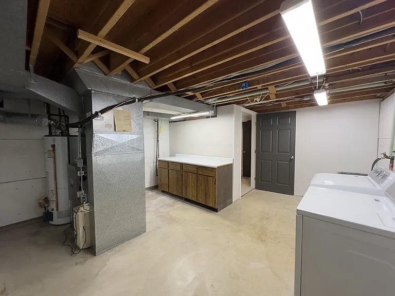 Laundry / utility room in basement.