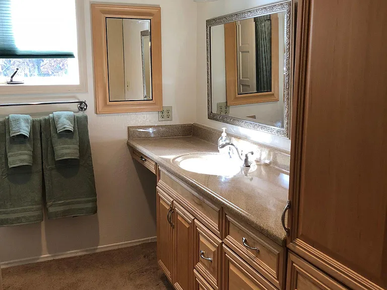 Upstairs hallway bath has lots of storage with tub/shower. Entry directly across hall from master bedroom door.