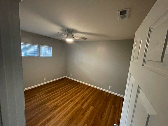 Bedroom 1: New floors, fixtures, and windows