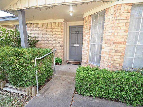Greet your guests with a big shaded porch! This fine one story home features quality brick on all sides!